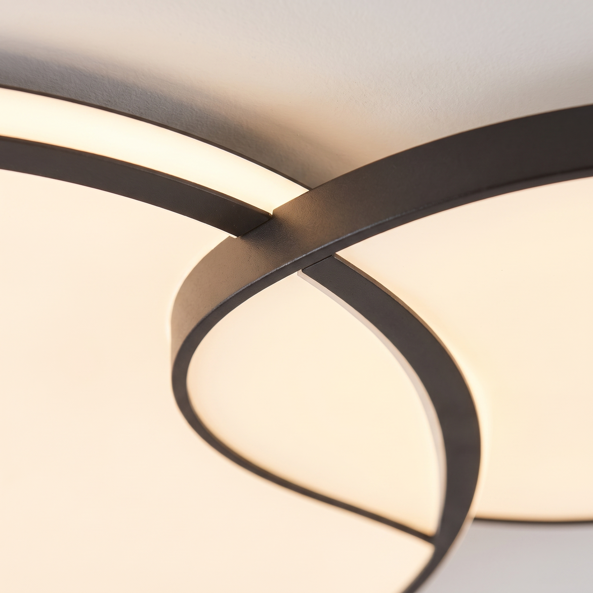 Close detail of the slim rim where the panel meets the ceiling