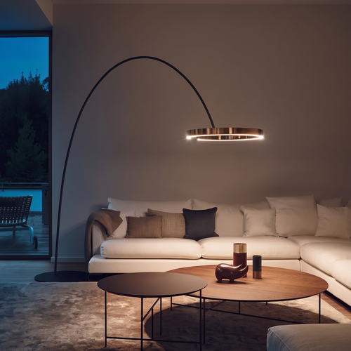Arc ring floor lamp shown full height in a living room for scale