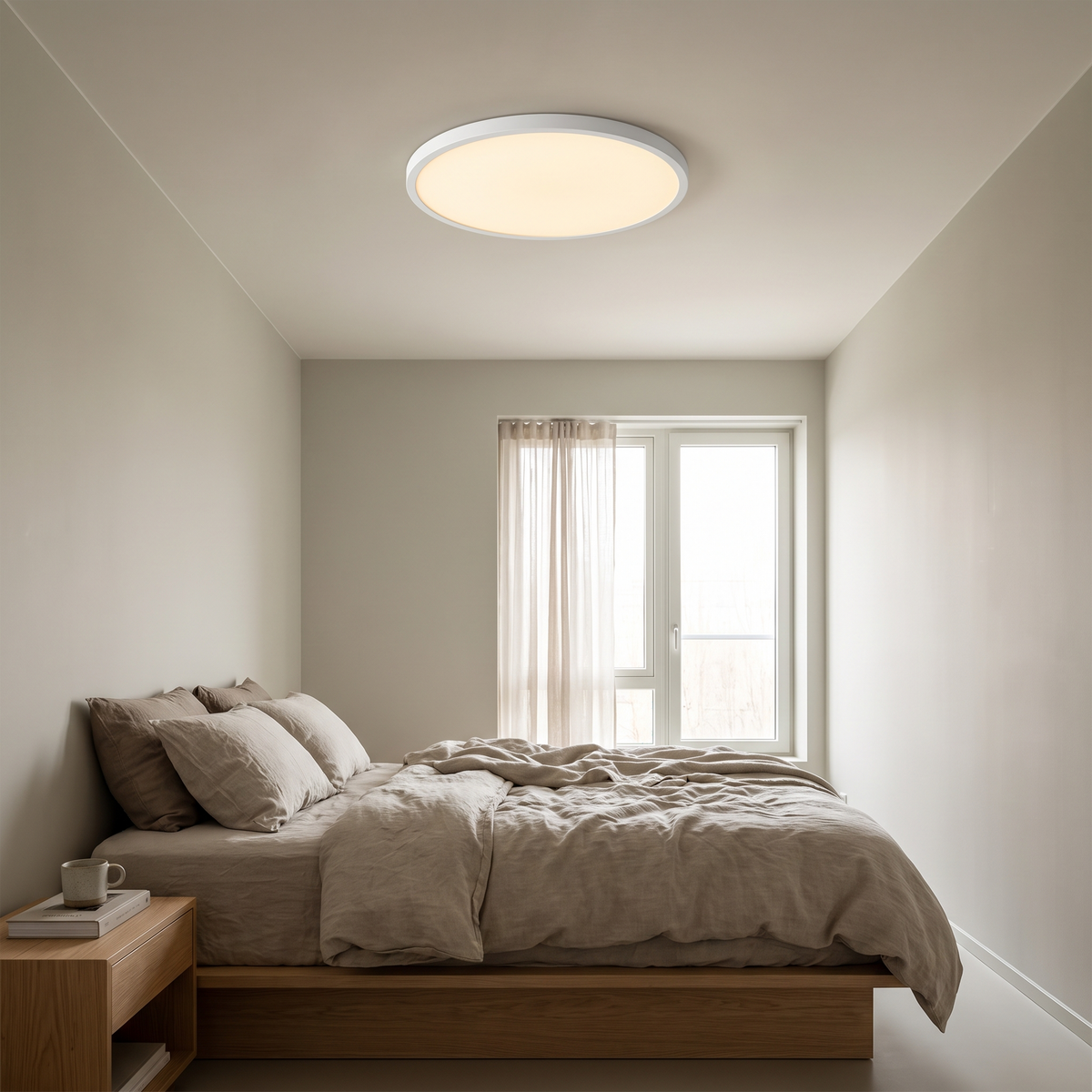Ultra-thin round ceiling light shown in a bedroom for scale