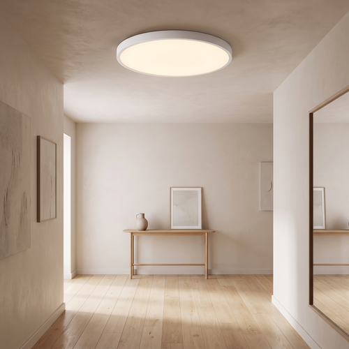 Ultra-thin round ceiling light lit in a contemporary hallway